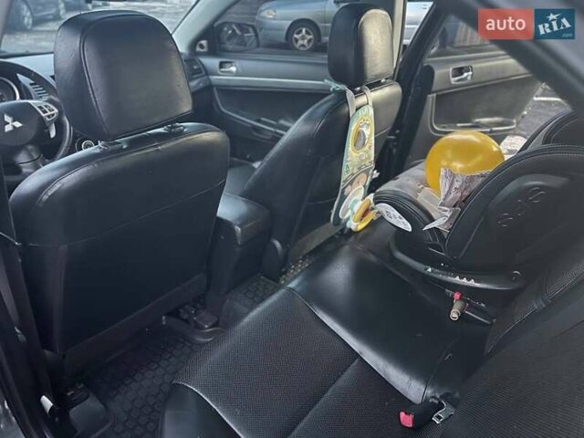 Серый Мицубиси Лансер, объемом двигателя 2 л и пробегом 170 тыс. км за 6999 $, фото 9 на Automoto.ua