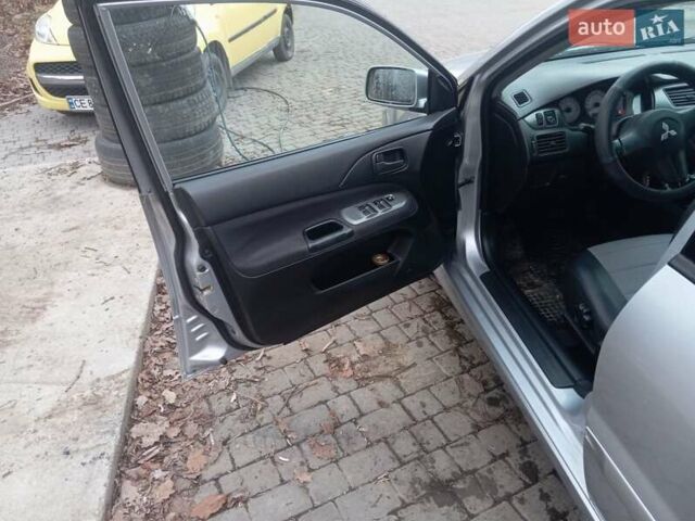 Серый Мицубиси Лансер, объемом двигателя 1.58 л и пробегом 175 тыс. км за 4000 $, фото 2 на Automoto.ua