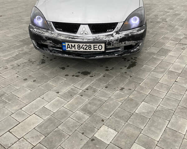 Серый Мицубиси Лансер, объемом двигателя 1.6 л и пробегом 263 тыс. км за 2350 $, фото 2 на Automoto.ua