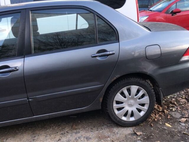 Серый Мицубиси Лансер, объемом двигателя 1.5 л и пробегом 269 тыс. км за 4200 $, фото 21 на Automoto.ua