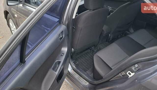 Серый Мицубиси Лансер, объемом двигателя 2 л и пробегом 189 тыс. км за 6800 $, фото 10 на Automoto.ua