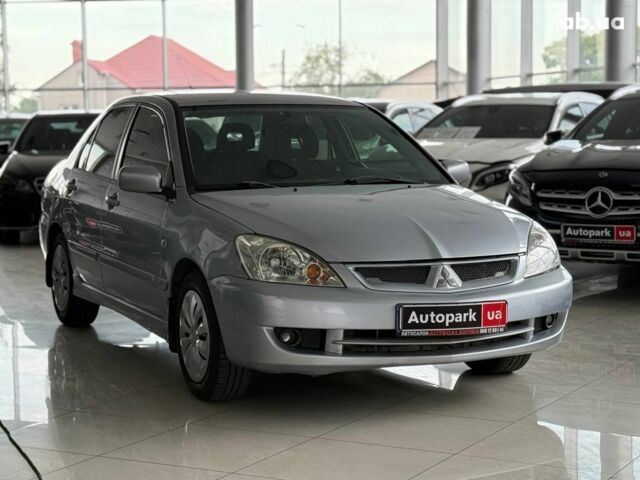 Серый Мицубиси Лансер, объемом двигателя 1.6 л и пробегом 174 тыс. км за 5990 $, фото 2 на Automoto.ua