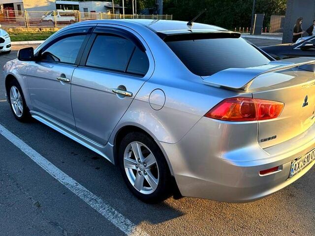 Серый Мицубиси Лансер, объемом двигателя 2 л и пробегом 122 тыс. км за 8200 $, фото 2 на Automoto.ua