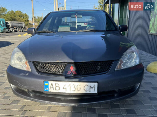 Сірий Міцубісі Lancer, об'ємом двигуна 1.58 л та пробігом 341 тис. км за 2200 $, фото 3 на Automoto.ua