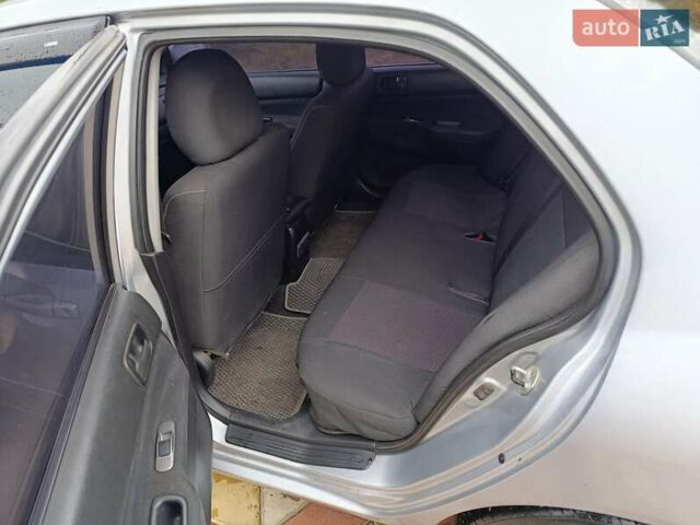 Серый Мицубиси Лансер, объемом двигателя 1.6 л и пробегом 268 тыс. км за 2900 $, фото 4 на Automoto.ua