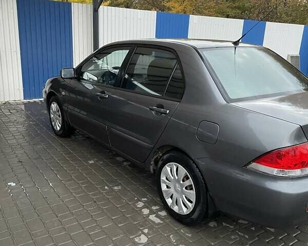 Сірий Міцубісі Lancer, об'ємом двигуна 1.6 л та пробігом 330 тис. км за 3500 $, фото 14 на Automoto.ua