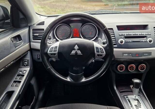 Серый Мицубиси Лансер, объемом двигателя 2 л и пробегом 213 тыс. км за 6550 $, фото 24 на Automoto.ua