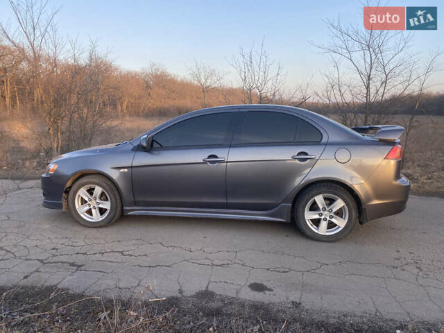 Сірий Міцубісі Lancer, об'ємом двигуна 2 л та пробігом 205 тис. км за 7000 $, фото 9 на Automoto.ua