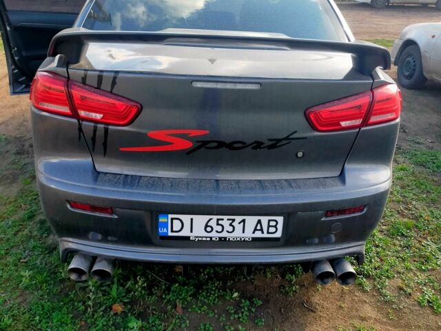 Серый Мицубиси Лансер, объемом двигателя 2 л и пробегом 351 тыс. км за 7000 $, фото 4 на Automoto.ua