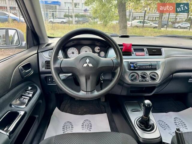 Сірий Міцубісі Lancer, об'ємом двигуна 1.58 л та пробігом 138 тис. км за 4990 $, фото 21 на Automoto.ua