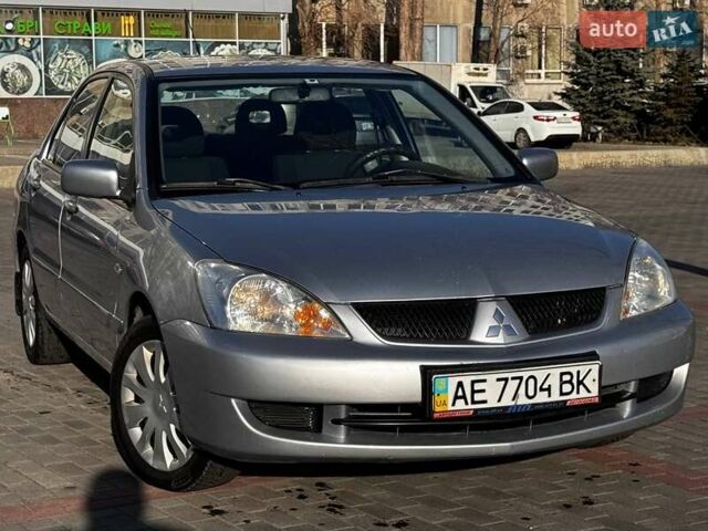 Сірий Міцубісі Lancer, об'ємом двигуна 1.6 л та пробігом 237 тис. км за 4950 $, фото 1 на Automoto.ua