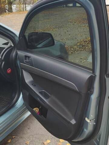 Сірий Міцубісі Lancer, об'ємом двигуна 2 л та пробігом 179 тис. км за 7700 $, фото 10 на Automoto.ua