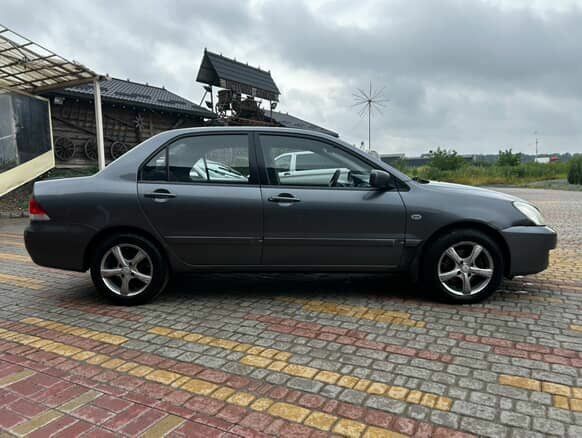 Серый Мицубиси Лансер, объемом двигателя 1.6 л и пробегом 213 тыс. км за 2400 $, фото 6 на Automoto.ua