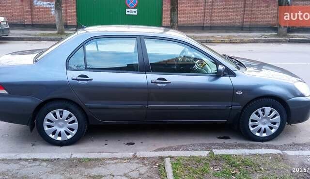 Міцубісі Lancer 2007 у Хмельницькому на Automoto.ua Сірий Міцубісі Lancer, об'ємом двигуна 1.58 л та пробігом 143 тис. км за 4100 $, фото 3 на Automoto.ua