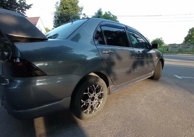 Сірий Міцубісі Lancer, об'ємом двигуна 1.6 л та пробігом 230 тис. км за 3950 $, фото 11 на Automoto.ua