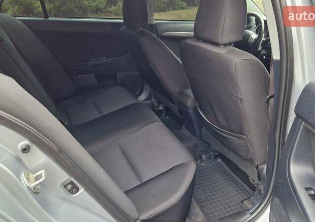 Серый Мицубиси Лансер, объемом двигателя 2 л и пробегом 213 тыс. км за 6550 $, фото 20 на Automoto.ua