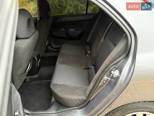 Сірий Міцубісі Lancer, об'ємом двигуна 1.58 л та пробігом 247 тис. км за 4900 $, фото 18 на Automoto.ua