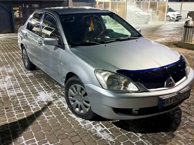 Сірий Міцубісі Lancer, об'ємом двигуна 1.6 л та пробігом 244 тис. км за 3900 $, фото 1 на Automoto.ua