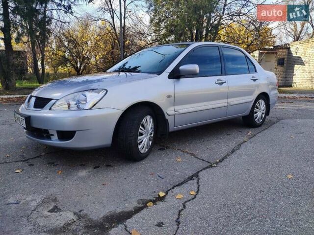 Сірий Міцубісі Lancer, об'ємом двигуна 1.58 л та пробігом 122 тис. км за 6300 $, фото 6 на Automoto.ua