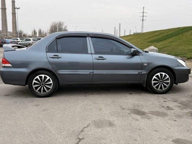 Сірий Міцубісі Lancer, об'ємом двигуна 1.6 л та пробігом 270 тис. км за 4300 $, фото 2 на Automoto.ua
