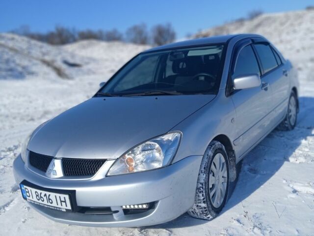 Серый Мицубиси Лансер, объемом двигателя 1.6 л и пробегом 277 тыс. км за 4599 $, фото 3 на Automoto.ua