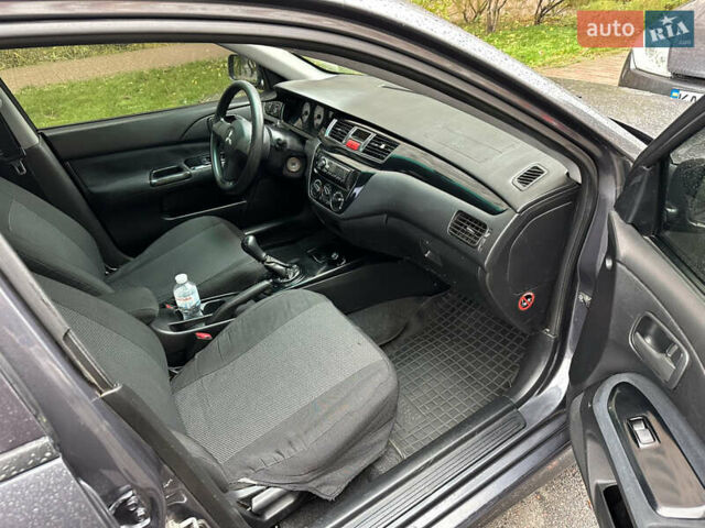 Серый Мицубиси Лансер, объемом двигателя 1.6 л и пробегом 115 тыс. км за 2800 $, фото 8 на Automoto.ua