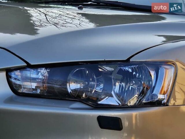 Серый Мицубиси Лансер, объемом двигателя 2 л и пробегом 282 тыс. км за 5450 $, фото 25 на Automoto.ua