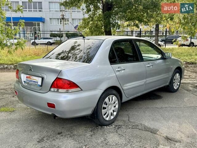 Сірий Міцубісі Lancer, об'ємом двигуна 1.58 л та пробігом 138 тис. км за 4990 $, фото 11 на Automoto.ua
