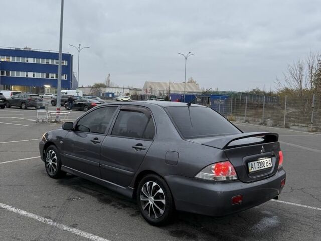 Серый Мицубиси Лансер, объемом двигателя 1.6 л и пробегом 350 тыс. км за 2850 $, фото 6 на Automoto.ua