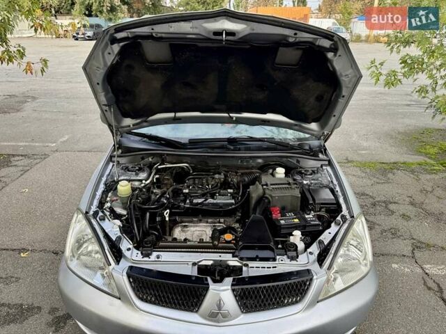 Сірий Міцубісі Lancer, об'ємом двигуна 1.58 л та пробігом 138 тис. км за 4990 $, фото 31 на Automoto.ua