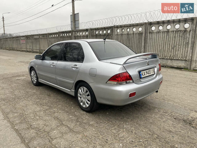 Серый Мицубиси Лансер, объемом двигателя 1.58 л и пробегом 240 тыс. км за 5500 $, фото 3 на Automoto.ua