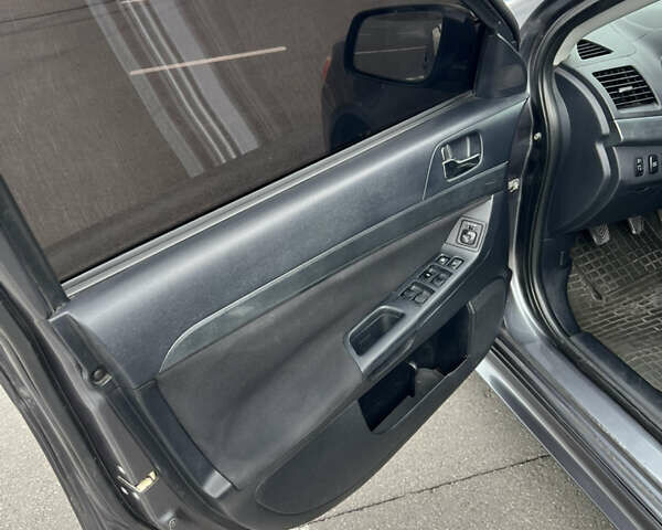 Сірий Міцубісі Lancer, об'ємом двигуна 2 л та пробігом 300 тис. км за 6299 $, фото 11 на Automoto.ua