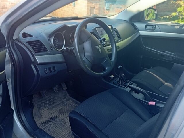 Серый Мицубиси Лансер, объемом двигателя 1.5 л и пробегом 215 тыс. км за 4999 $, фото 6 на Automoto.ua