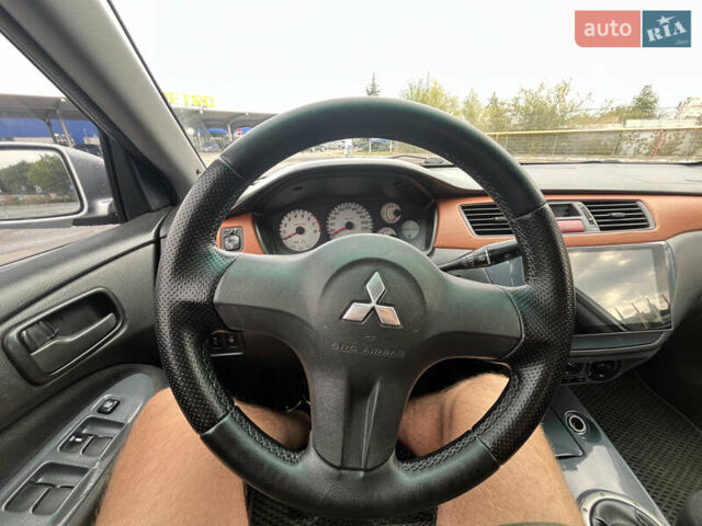 Серый Мицубиси Лансер, объемом двигателя 1.58 л и пробегом 232 тыс. км за 4900 $, фото 19 на Automoto.ua