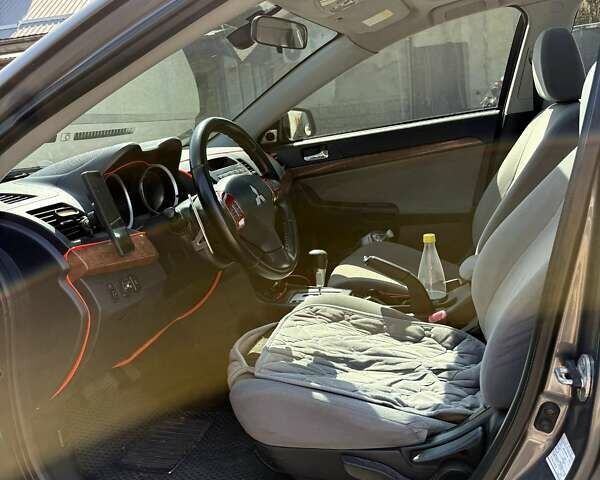 Сірий Міцубісі Lancer, об'ємом двигуна 2 л та пробігом 203 тис. км за 6200 $, фото 12 на Automoto.ua