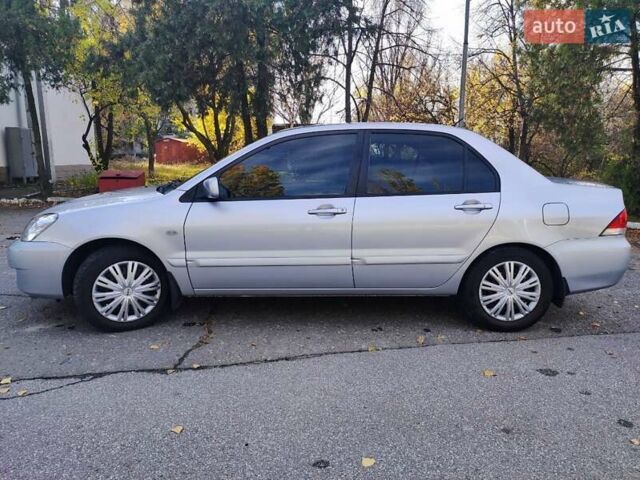 Сірий Міцубісі Lancer, об'ємом двигуна 1.58 л та пробігом 122 тис. км за 6300 $, фото 5 на Automoto.ua