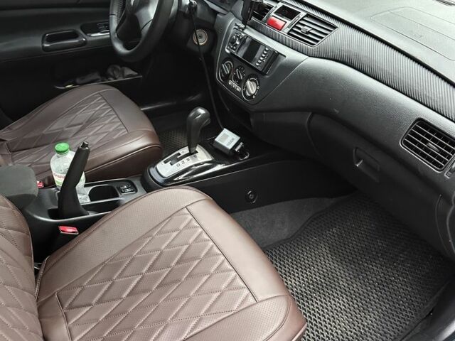 Серый Мицубиси Лансер, объемом двигателя 1.6 л и пробегом 238 тыс. км за 4300 $, фото 3 на Automoto.ua