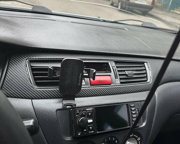 Серый Мицубиси Лансер, объемом двигателя 1.6 л и пробегом 238 тыс. км за 4400 $, фото 11 на Automoto.ua