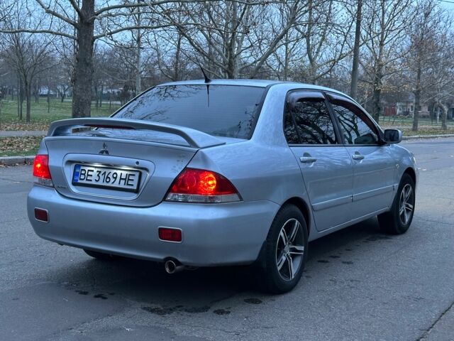 Сірий Міцубісі Lancer, об'ємом двигуна 1.6 л та пробігом 210 тис. км за 4750 $, фото 3 на Automoto.ua