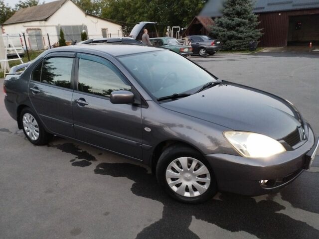 Сірий Міцубісі Lancer, об'ємом двигуна 1.6 л та пробігом 178 тис. км за 5464 $, фото 1 на Automoto.ua