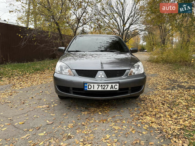 Сірий Міцубісі Lancer, об'ємом двигуна 1.58 л та пробігом 247 тис. км за 4900 $, фото 16 на Automoto.ua