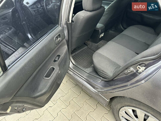 Сірий Міцубісі Lancer, об'ємом двигуна 1.6 л та пробігом 115 тис. км за 2800 $, фото 11 на Automoto.ua