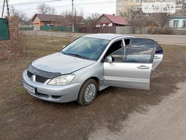 Сірий Міцубісі Lancer, об'ємом двигуна 1.6 л та пробігом 197 тис. км за 5100 $, фото 18 на Automoto.ua