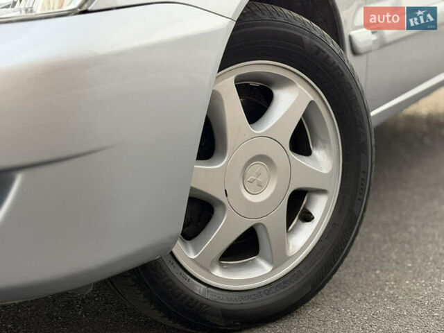Сірий Міцубісі Lancer, об'ємом двигуна 1.3 л та пробігом 160 тис. км за 4999 $, фото 3 на Automoto.ua