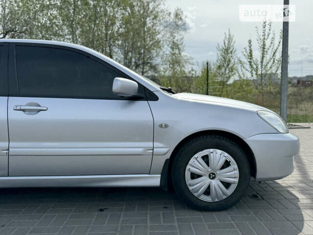 Сірий Міцубісі Lancer, об'ємом двигуна 1.58 л та пробігом 240 тис. км за 5500 $, фото 4 на Automoto.ua