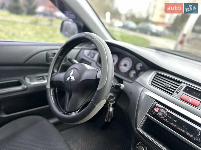Сірий Міцубісі Lancer, об'ємом двигуна 1.6 л та пробігом 177 тис. км за 2800 $, фото 33 на Automoto.ua