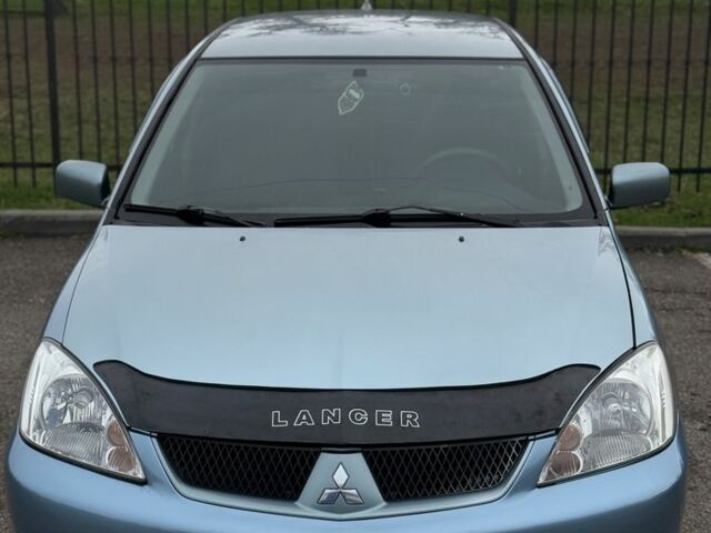 Серый Мицубиси Лансер, объемом двигателя 1.6 л и пробегом 238 тыс. км за 4300 $, фото 22 на Automoto.ua