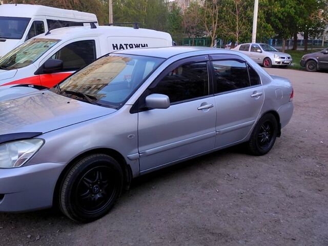 Серый Мицубиси Лансер, объемом двигателя 1.6 л и пробегом 302 тыс. км за 3200 $, фото 3 на Automoto.ua