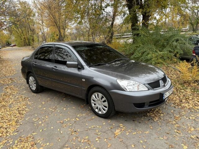 Сірий Міцубісі Lancer, об'ємом двигуна 1.6 л та пробігом 247 тис. км за 4900 $, фото 1 на Automoto.ua