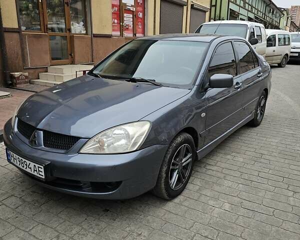 Серый Мицубиси Лансер, объемом двигателя 1.58 л и пробегом 260 тыс. км за 3700 $, фото 3 на Automoto.ua